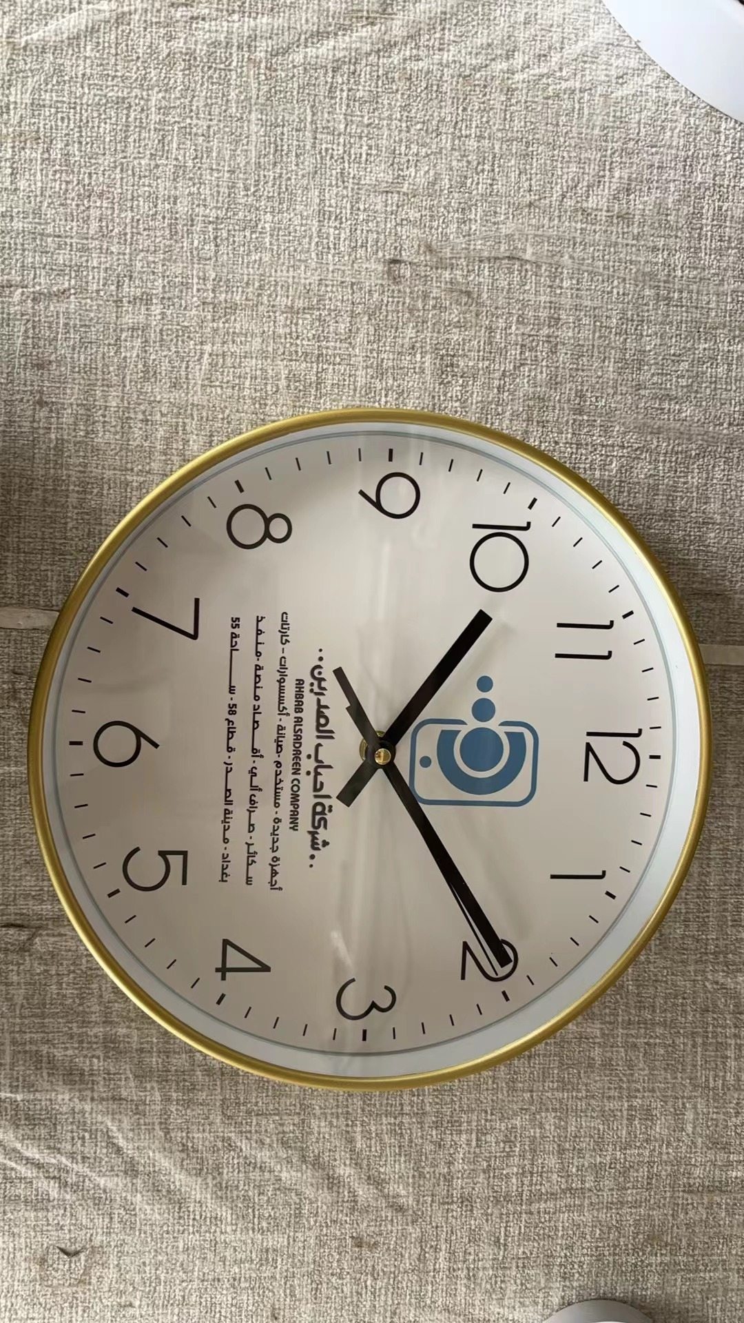 Arabic company custom wall clock with gold rim and printed logo