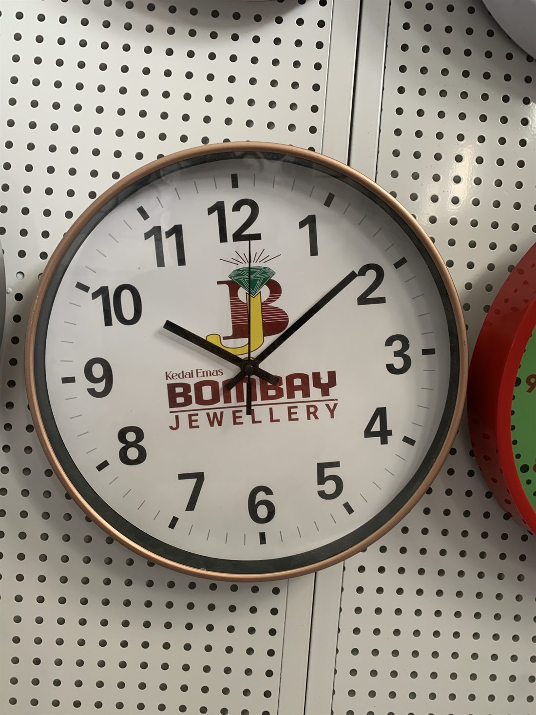 Bombay Jewellery custom logo wall clock with rose gold frame