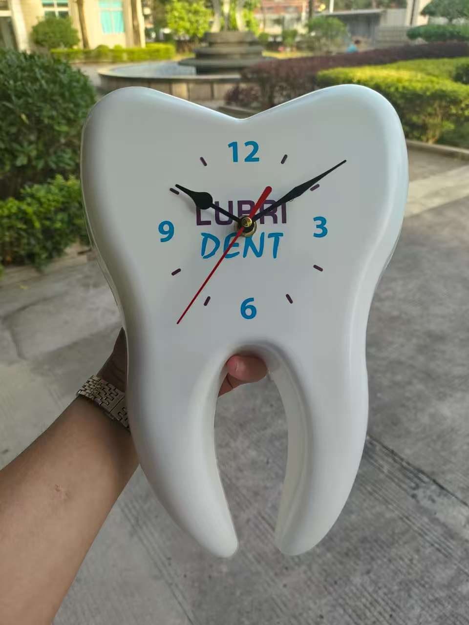 Tooth shaped dental custom clock with blue numbers and clinic logo