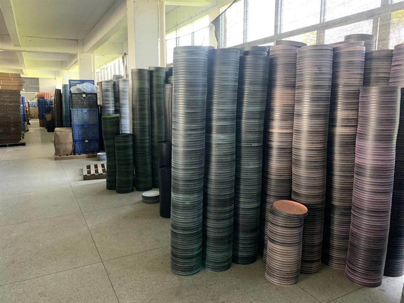 Stacks of clock frames and parts inside Bonmo Clock factory