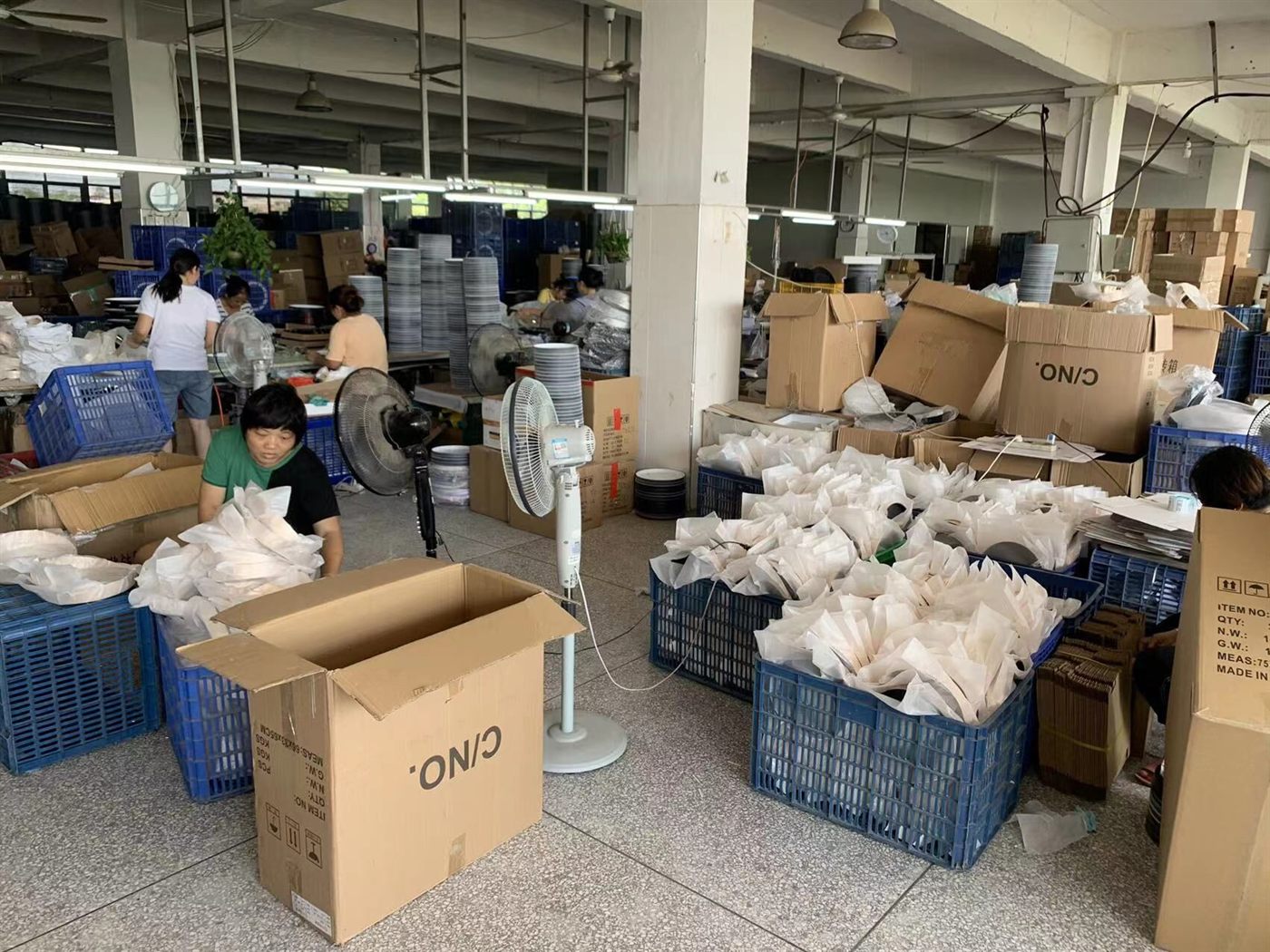 Bonmo Clock production floor with assembly and packing work