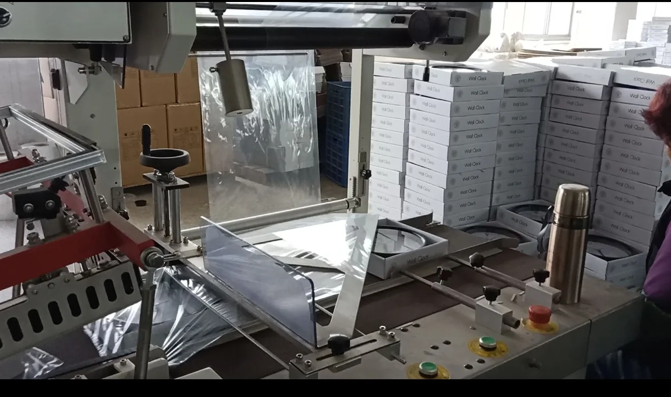 Packaging machine and boxed wall clocks in the production area